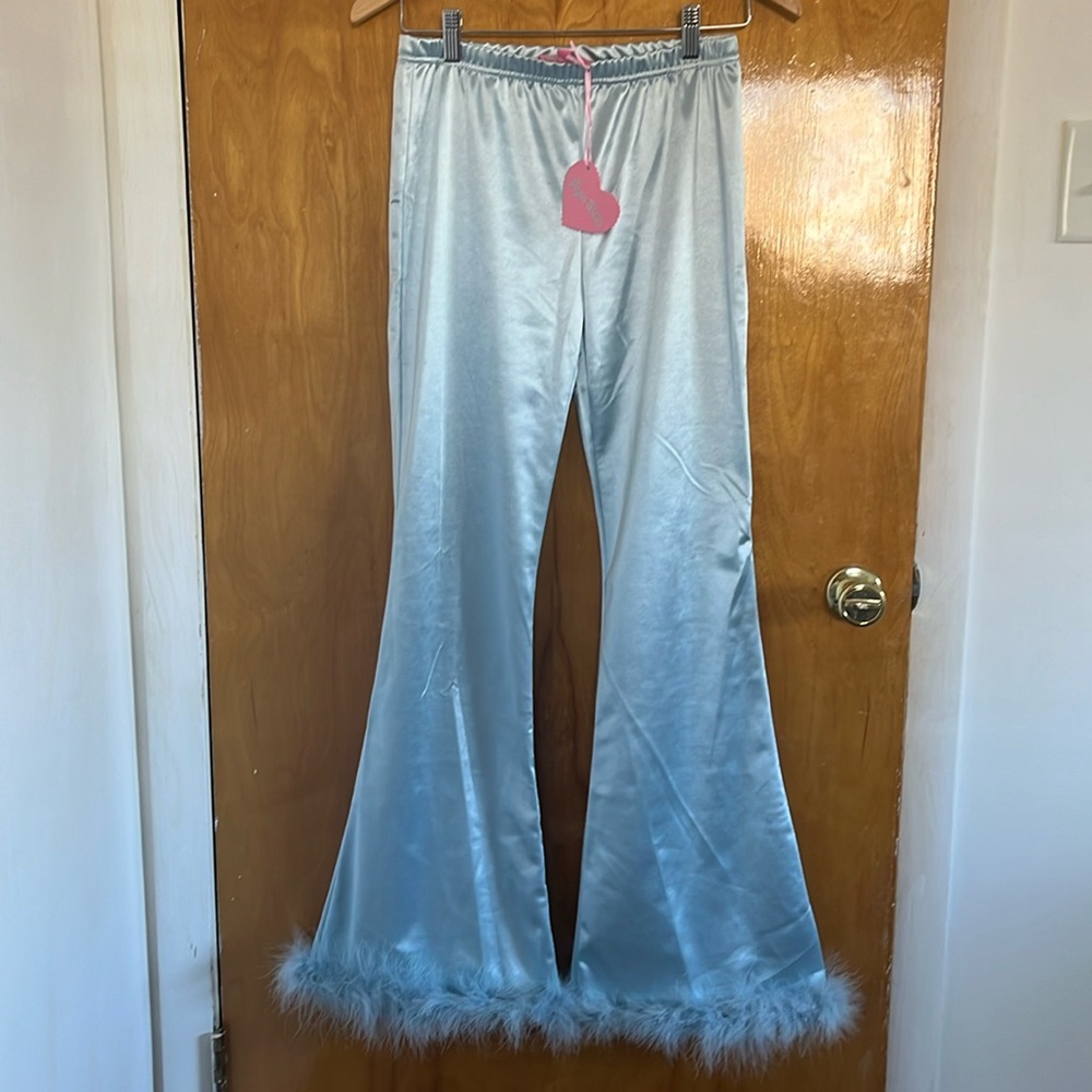 Light blue satin flare pants with feather trim